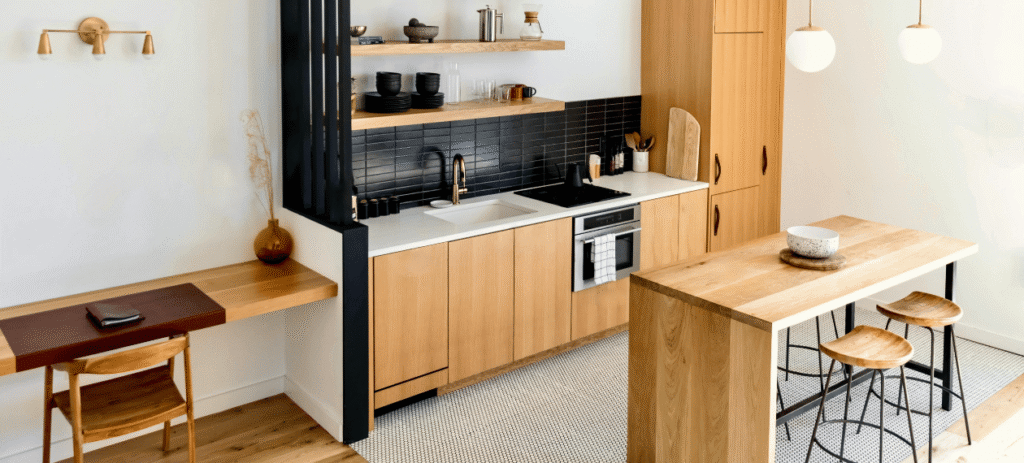 Modern kitchen featuring natural wood cabinetry and warm finishes in The Woodlands